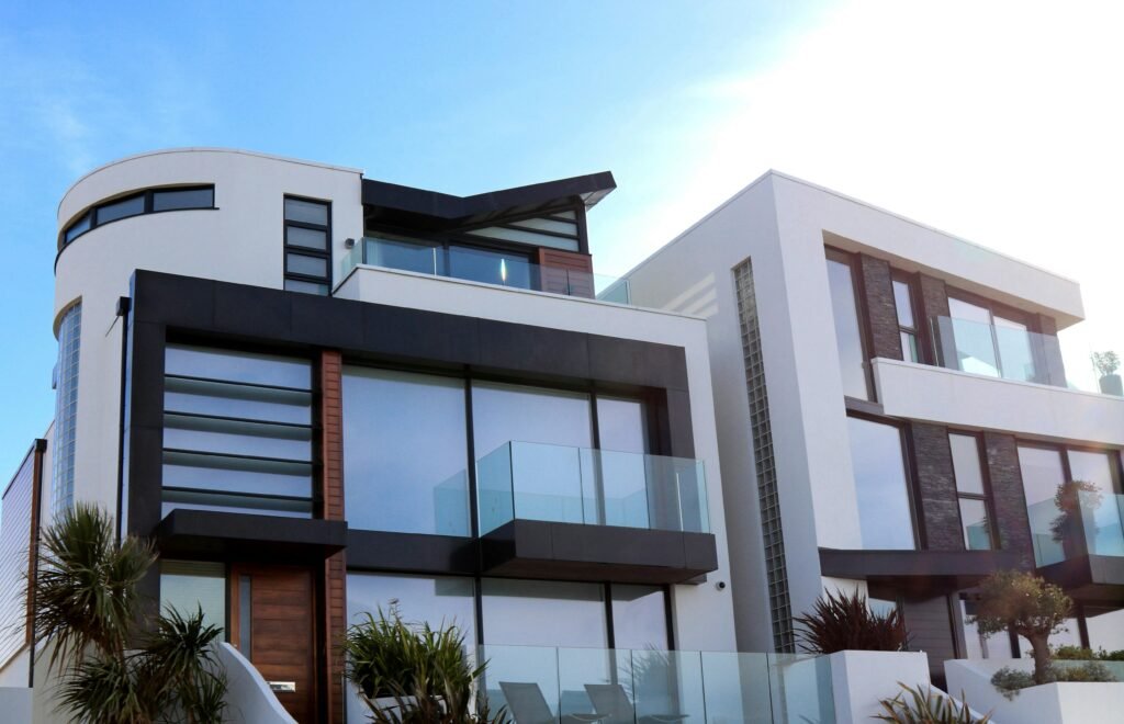 pexels photo 323780 323780 Contemporary luxury home with glass balconies in Poole, UK, showcasing modern architectural design.